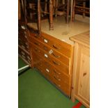 A MID CENTURY BEECHWOOD PLAN CHEST, with six drawers, brass effect handles and card holder and a