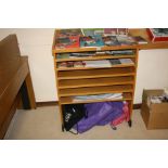 AN OAK VENEERED LEAFLET STAND WITH FIVE PULL OUT SHELVES, one static and an angle reading top