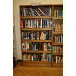 AN OAK VENEERED STANDING BOOKCASE, with four adjustable shelves, 101x35x200cm high (s.d) (content