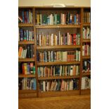 AN OAK VENEERED STANDING BOOKCASE, with four adjustable shelves, 101x35x200cm high (s.d) (content