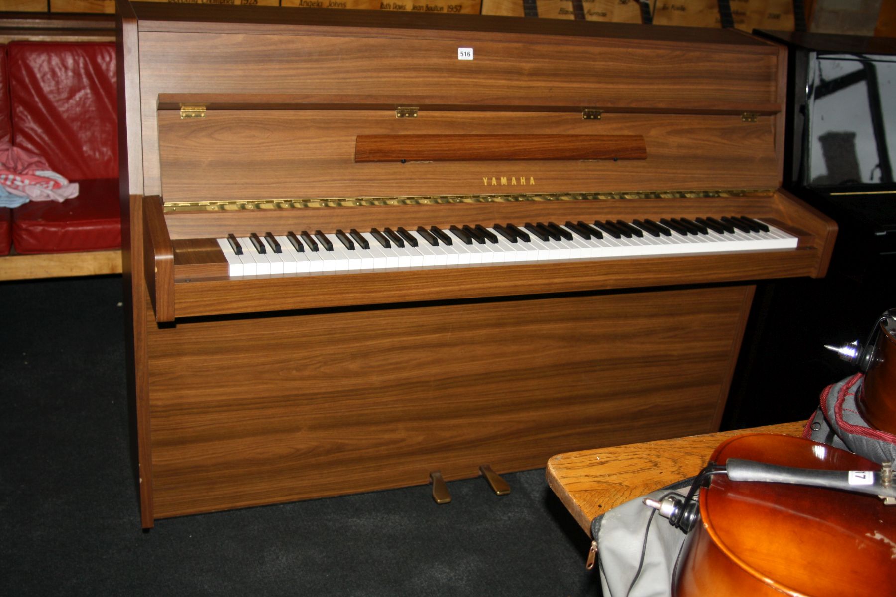 A YAMAHA E108 UPRIGHT PIANO, with walnut finish Serial No.5903420