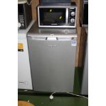 A SILVER BEKO UNDER COUNTER FRIDGE, 55cm wide and a Morphy Richards microwave