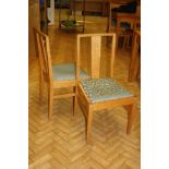 A SET OF FIVE OAK DINING CHAIRS, with upholstered lift out seat pads