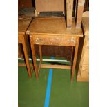 A VINTAGE SINGLE SCHOOL DESK, with oak veneered lift up lid over a beechwood frame, with inkwell