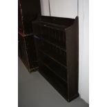 A STAINED PINE EDWARDIAN BOOKCASE, with four fixed shelves, 109x20x126cm high