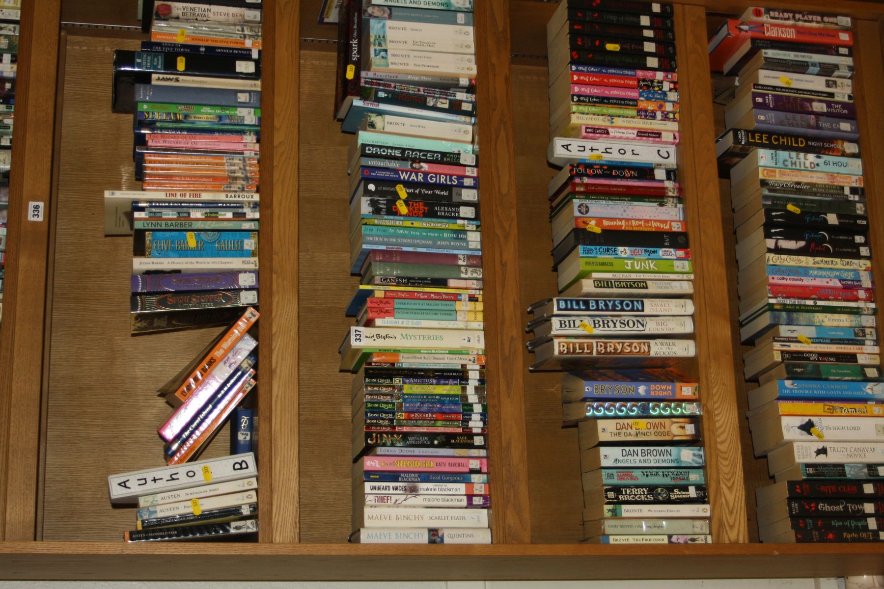 FIVE SHELVES OF FICTION BOOKS, by authors such as Bill Bryson, Dan Brown, Jane Austen, etc (bookcase