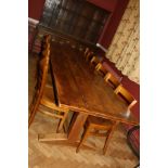 AN EARLY 20TH CENTURY OAK REFECTORY TABLE, with 3cm thick solid oak top with bread board edges 274cm