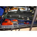 A STENTOR STUDENT 1 1/2 SIZE VIOLIN, with bow and three hard cases