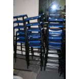 EIGHTEEN STACKING LABORATORY STOOLS, with blue plastic seats on tubular metal legs, 62cm high