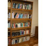 AN OAK VENEERED STANDING BOOKCASE, with four adjustable shelves, 101x35x200cm high (s.d) (content