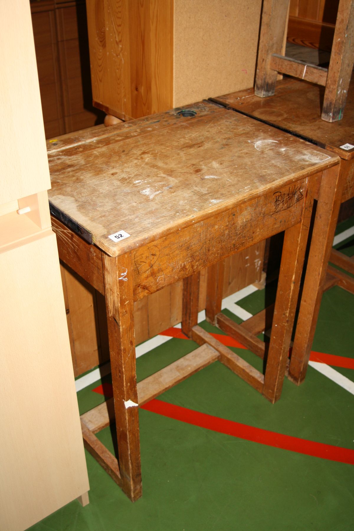 A VINTAGE SINGLE SCHOOL DESK, with oak veneered lift up lid over a beechwood frame, with inkwell