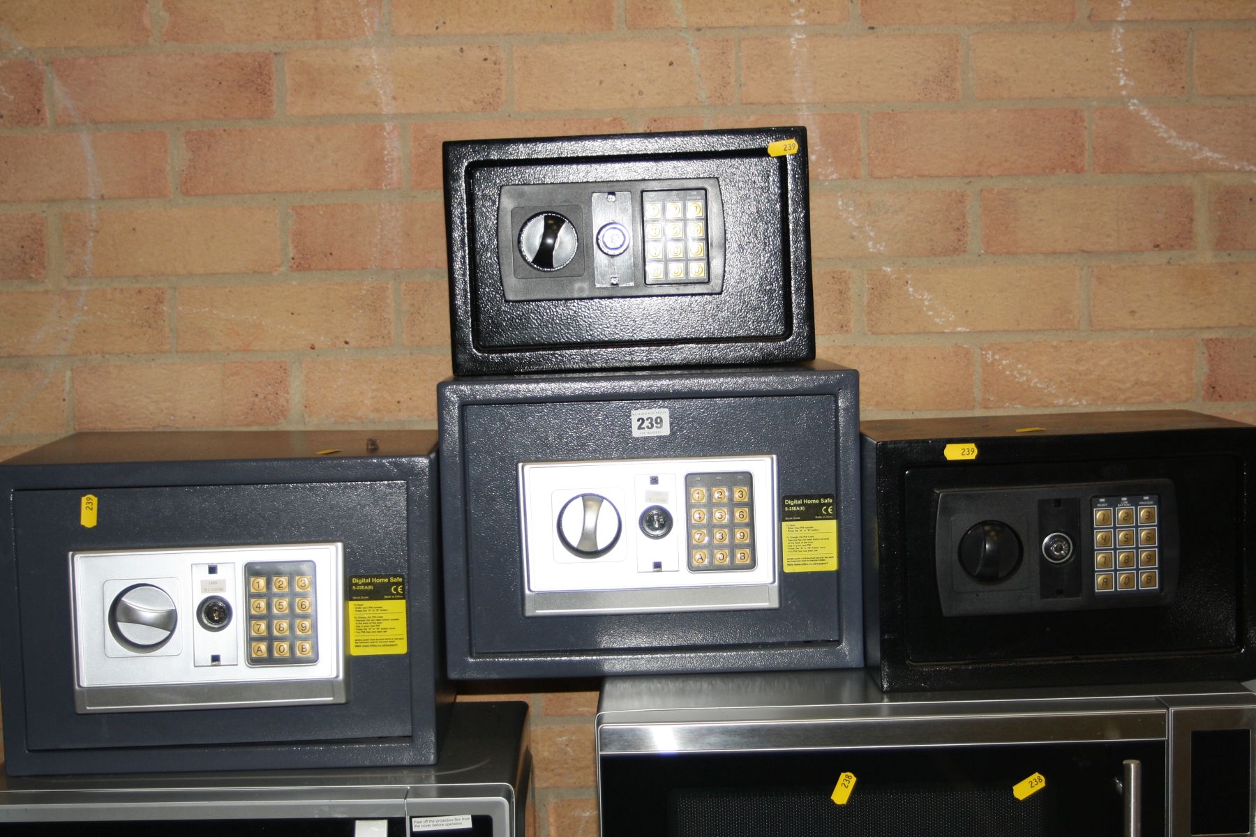 FOUR ELECTRONIC PERSONAL SAFES, two Hilka and two black