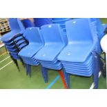 NINETEEN STACKING CLASSROOM CHAIRS, with blue plastic moulded rest and blue tubular metal legs (s.