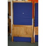 A CORONA PINE SINGLE BED FRAME AND A WATERPROOF MATTRESS, 98cm wide