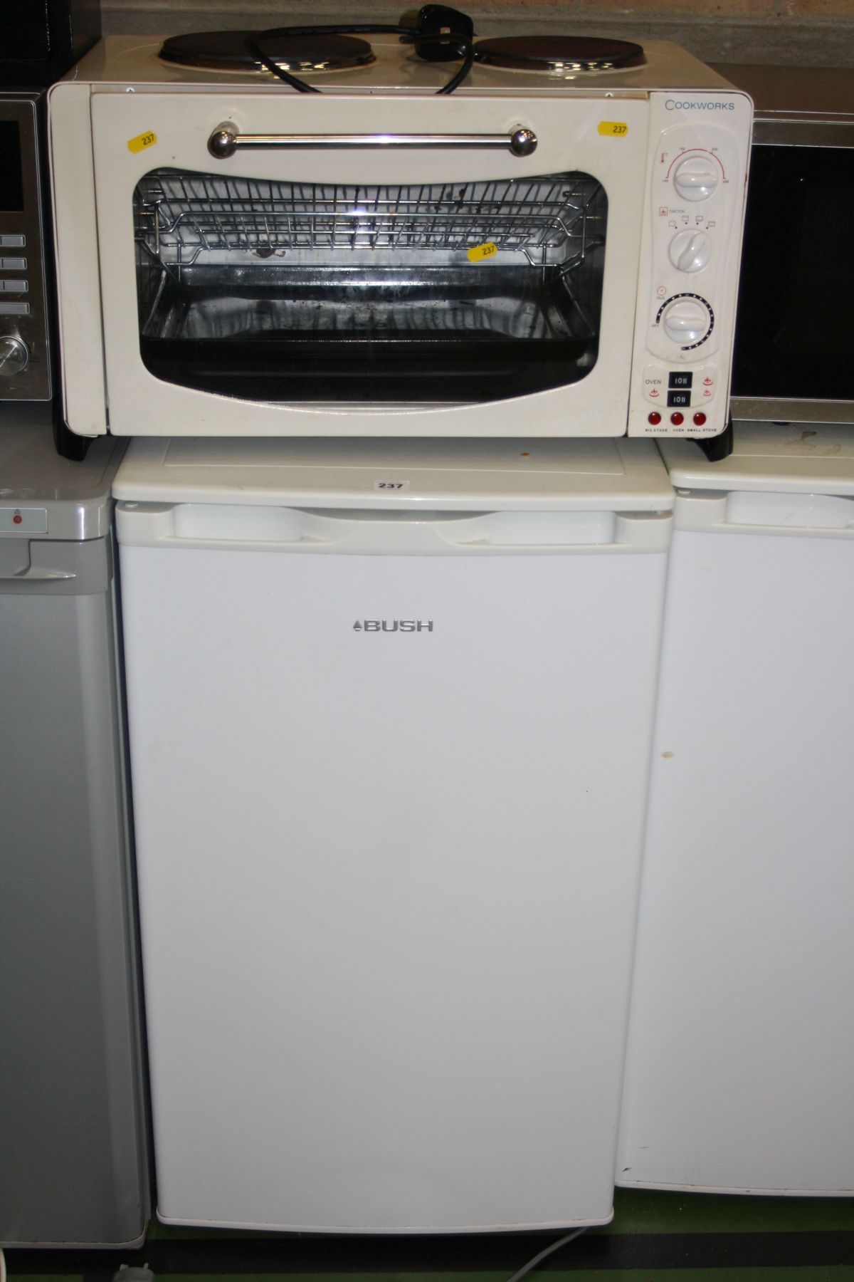 A BUSH UNDERCOUNTER FRIDGE, 50cm wide and a Cookworks table top grill