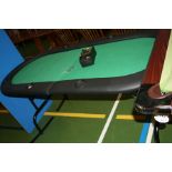 A FOLDING POKER TABLE, with padded edges and chip holders inserted into edges 185x82x76cm high and