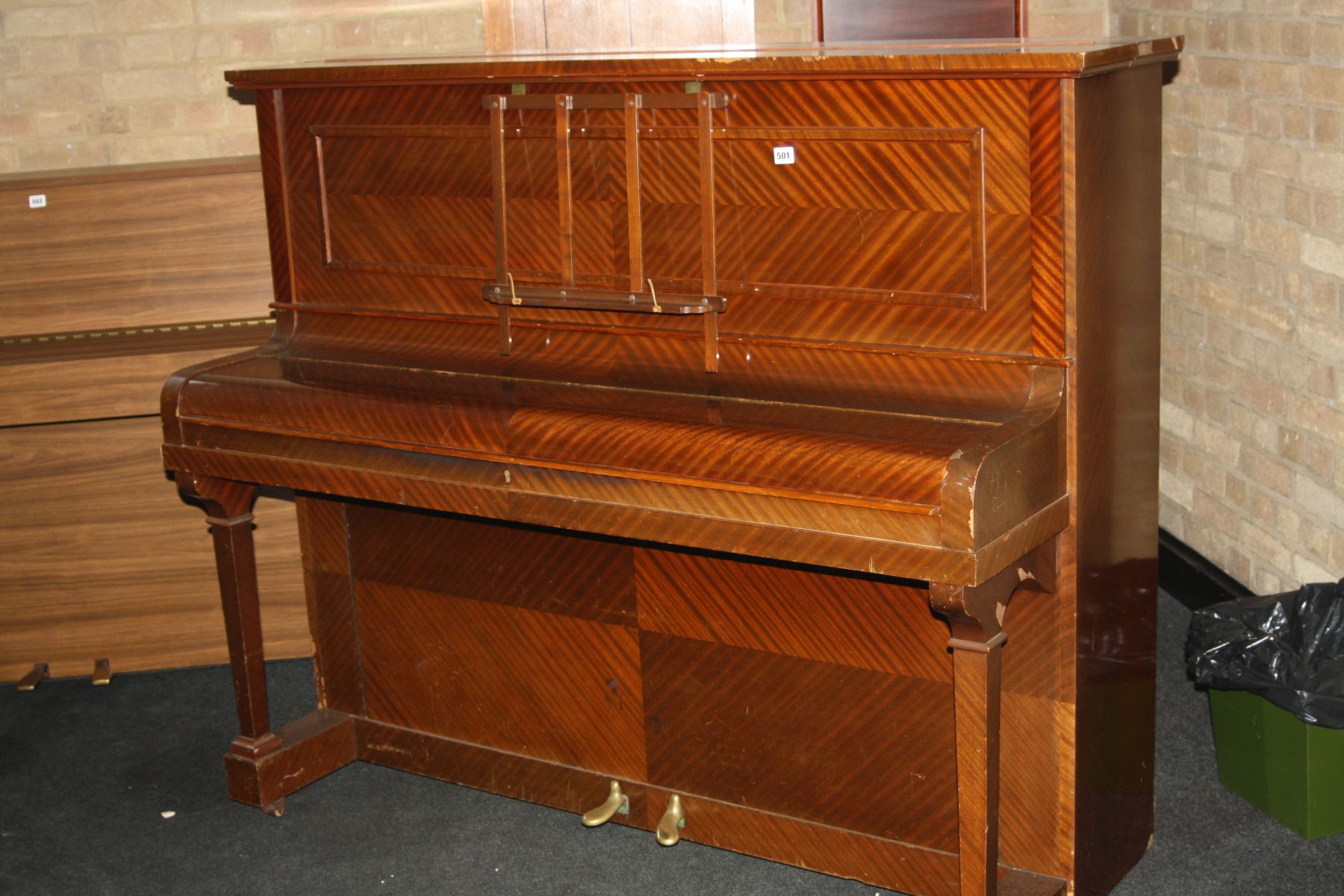 AN UNNAMED UPRIGHT PIANO, with quarter cut mahogany veneered case 154x130cm high (s.d)