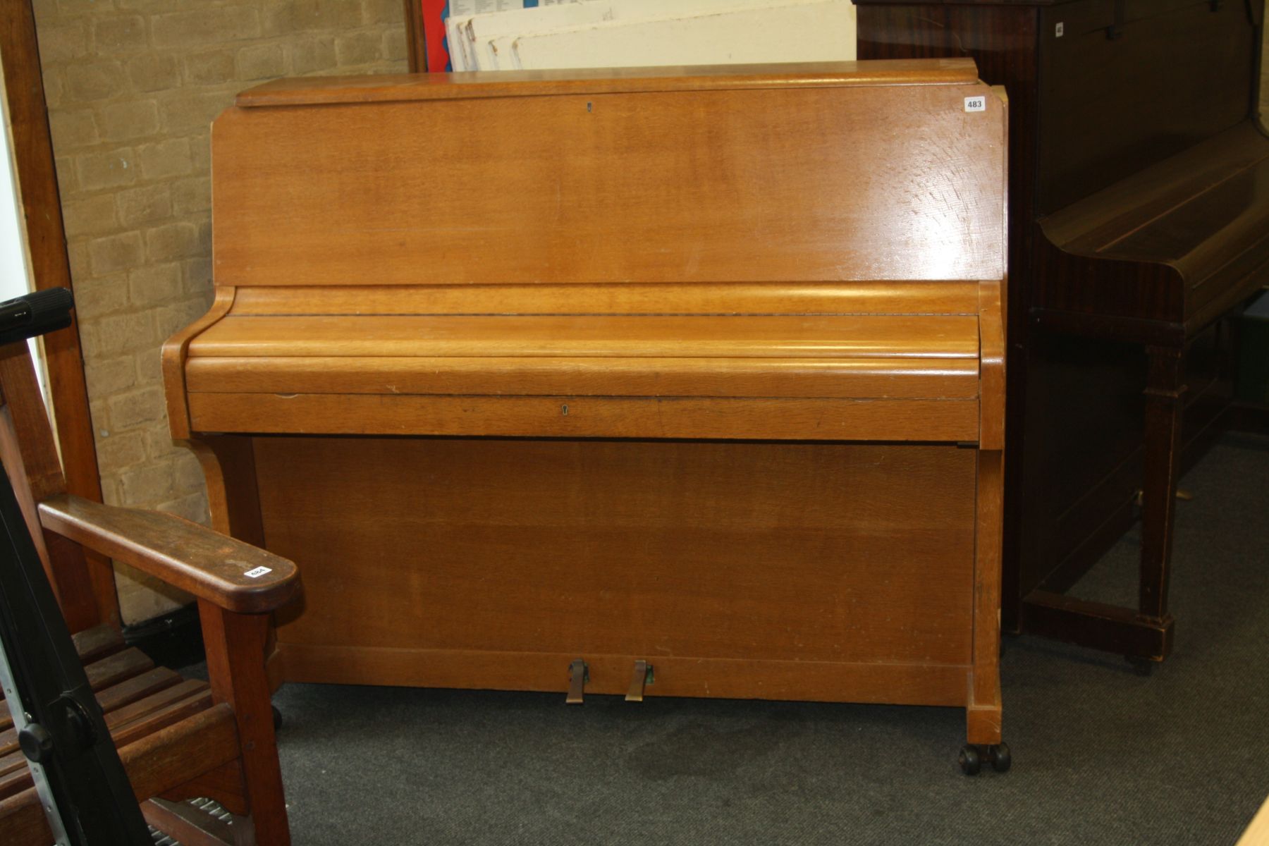A ZENDER UPRIGHT PIANO, with oak case (s.d)