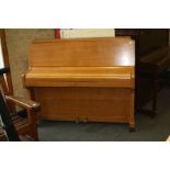 A ZENDER UPRIGHT PIANO, with oak case (s.d)