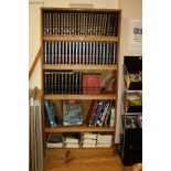 AN OAK VENEERED STANDING BOOKCASE, with four adjustable shelves, 101x35x200cm high (s.d) (content