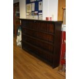 A VICTORIAN STAINED PINE BOOKCASE, with four fixed shelves, tongue and groove back boarding and an