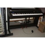 A YAMAHA CLAVINOVA CLP-311 DIGITAL PIANO, with rosewood effect finish