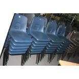 SEVENTEEN STACKING CLASSROOM CHAIRS, with moulded blue plastic seats over a tubular metal frame