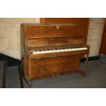 A BENSON UPRIGHT PIANO, in a walnut case