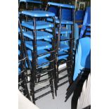 TWELVE STACKING LABORATORY STOOLS, with blue plastic seats on tubular metal legs, 62cm high