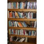 FIVE SHELVES OF FICTIONAL NOVELS, by Authors such as Graham Greene, Thomas Harris, William