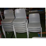 FIFTEEN GREY PLASTIC STACKING CHAIRS, with tubular metal legs (s.d)