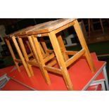 THREE MODERN BEECHWOOD LABORATORY STOOLS, with hand hold in centre of the seat, 51cm high (s.d)