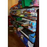 THE CONTENTS OF FIVE SHELVES, including electronic keyboards, toys, games, etc