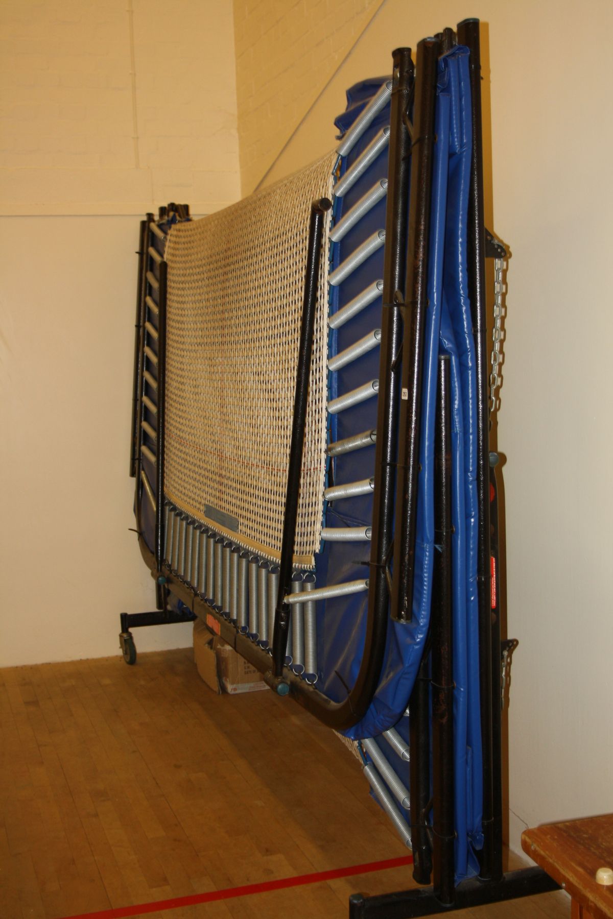 A TRAMPOLINE WITH FOLDING FRAME, with one Nissen deep mat