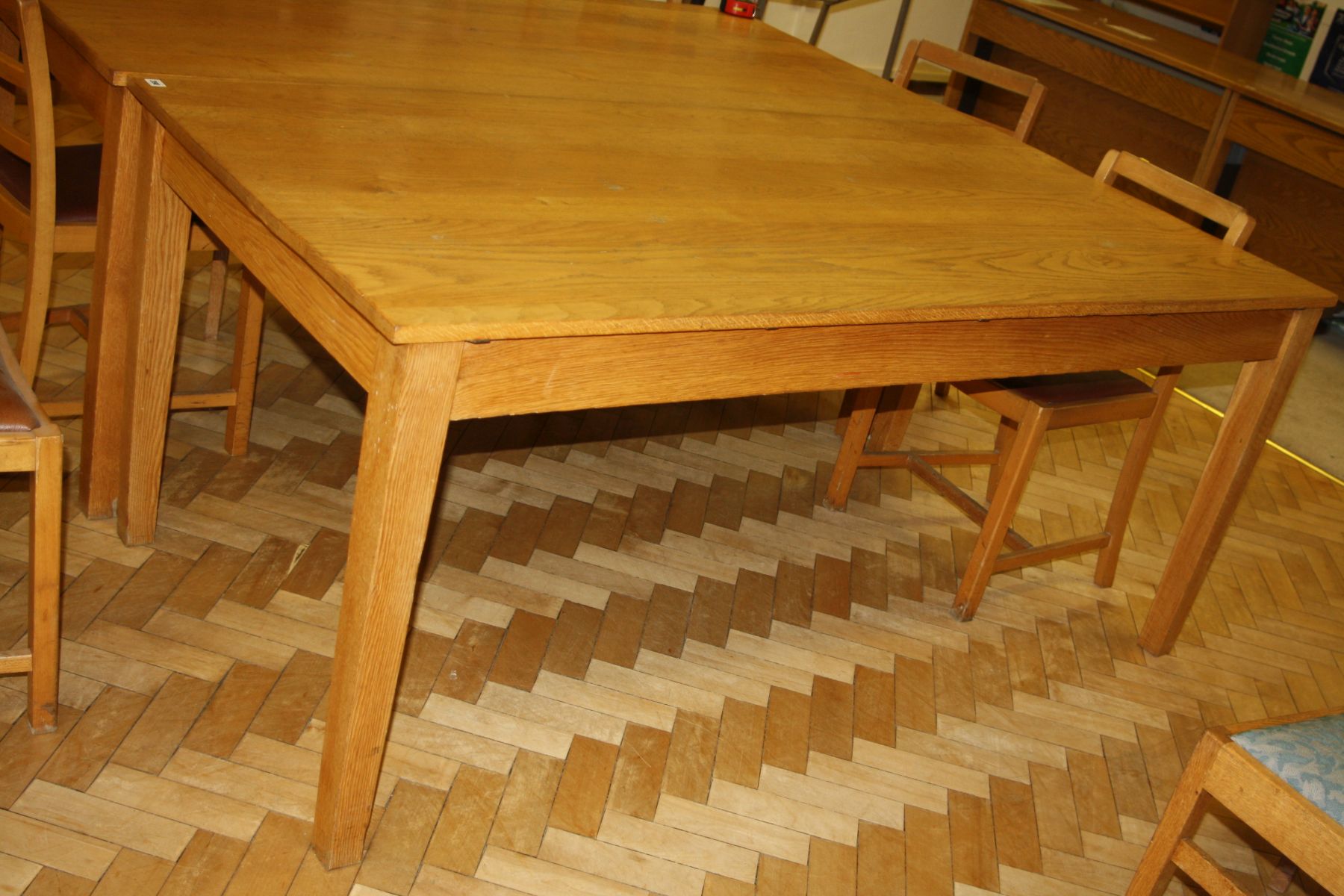 A SOLID OAK LIBRARY TABLE, with tapered block legs, 183x88x76cm high