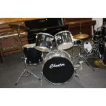 A CHESTER FIVE PIECE DRUM KIT, in black including 22''x15'' kick drum with pedal, a12''x9'' Tom, a