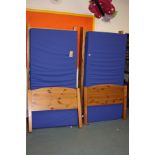 A PAIR OF PINE SINGLE BED FRAMES AND TWO WATERPROOF MATTRESS, 98cm wide