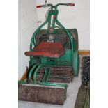 A WEBB IC3.5HP PETROL CYLINDER MOWER, with 24'' cut and seated roller attachment