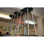 A SET OF THREE METAL AND PLASTIC LAB STOOLS, oval seats, heights 72cm - 74cm (3)