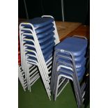 ELEVEN STACKING CLASSROOM STOOLS, with blue plastic shaped seats on a light grey tubular metal