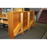 AN OAK DOUBLE SIDED LIBRARY BOOKCASE, with eighteen adjustable shelves 274x46x153cm high (s.d)