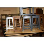FIVE VARIOUS WOODEN STOOLS WITH RECTANGULAR TOPS, four with painted finish (worn), all five with