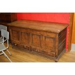 A GEORGIAN OAK MULE CHEST, with four raised panels and two drawers to the front, two raised panels