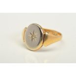 AN EARLY 20TH CENTURY 9CT GOLD DIAMOND SIGNET RING, designed as a single cut diamond within a star