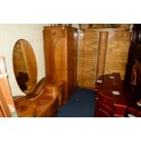 AN ART DECO WALNUT THREE PIECE BEDROOM SUITE, comprising of two double door wardrobes and a dressing