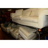 A PAIR OF CREAM UPHOLSTERED TWO SEATER SETTEES (one without back cushions), matching arm chair and