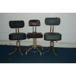 THREE INDUSTRIAL SWIVEL ADJUSTABLE CHAIRS WITH LEATHER UPHOLSTERY (3)