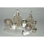 A COLLECTION OF TEN GLASS TOILET AND DRESSING TABLE JARS AND BOTTLES, nine with hallmarked silver