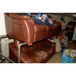 A BROWN LEATHER THREE PIECE LOUNGE SUITE, comprising of a three seater settee and an armchair (3)