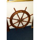 AN EARLY 20TH CENTURY MAHOGANY AND OAK BRASS BOUND EIGHT SPINDLED SHIPS WHEEL with bronzed centre